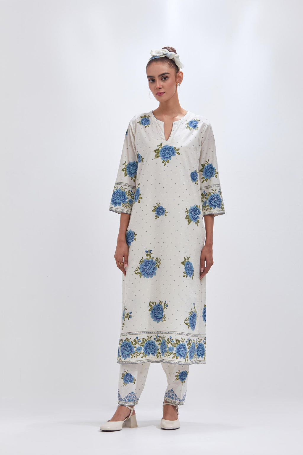 Off white cotton straight kurta set with all-over blue & green floral hand block print.
