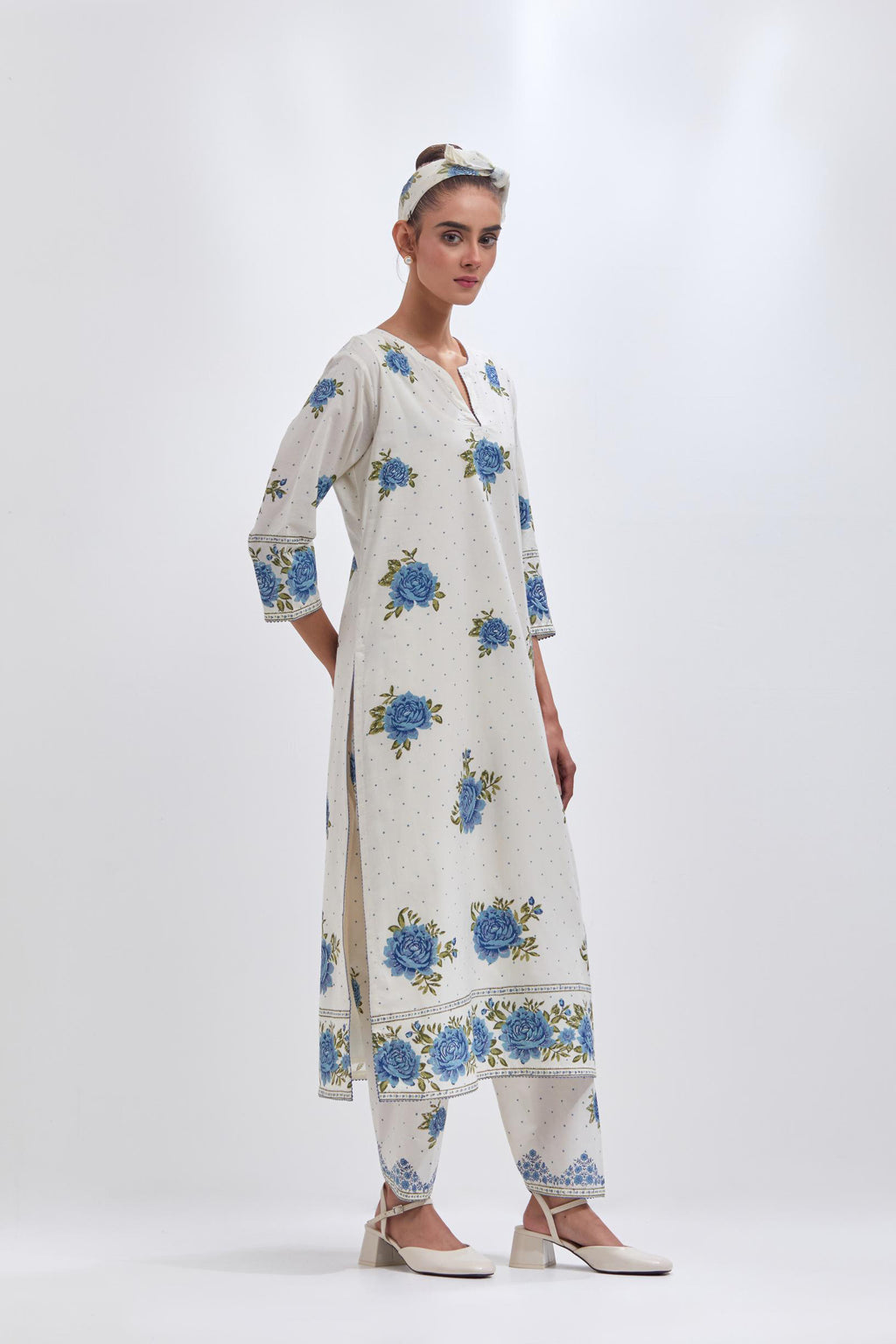 Off white cotton straight kurta set with all-over blue & green floral hand block print.