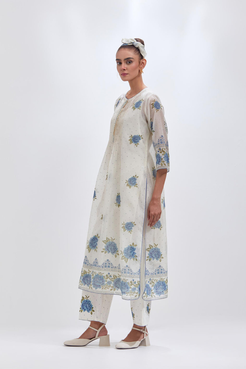 Off white cotton chanderi straight kurta set with all-over blue & green hand block print, highlighted with pin tucks at yoke.