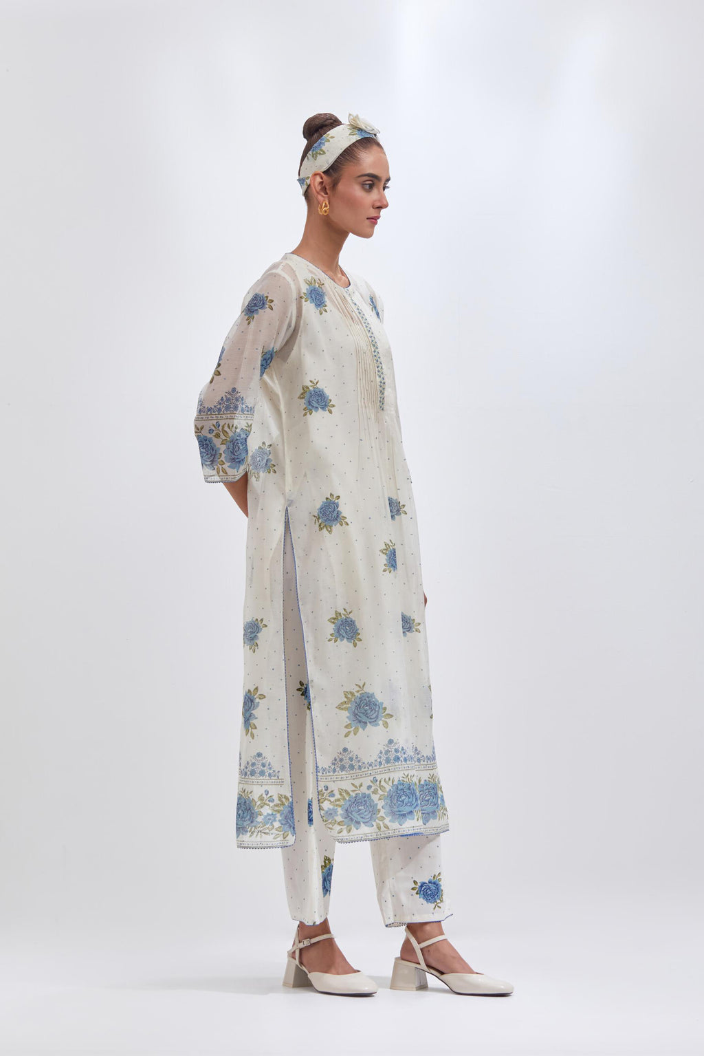 Off white cotton chanderi straight kurta set with all-over blue & green hand block print, highlighted with pin tucks at yoke.