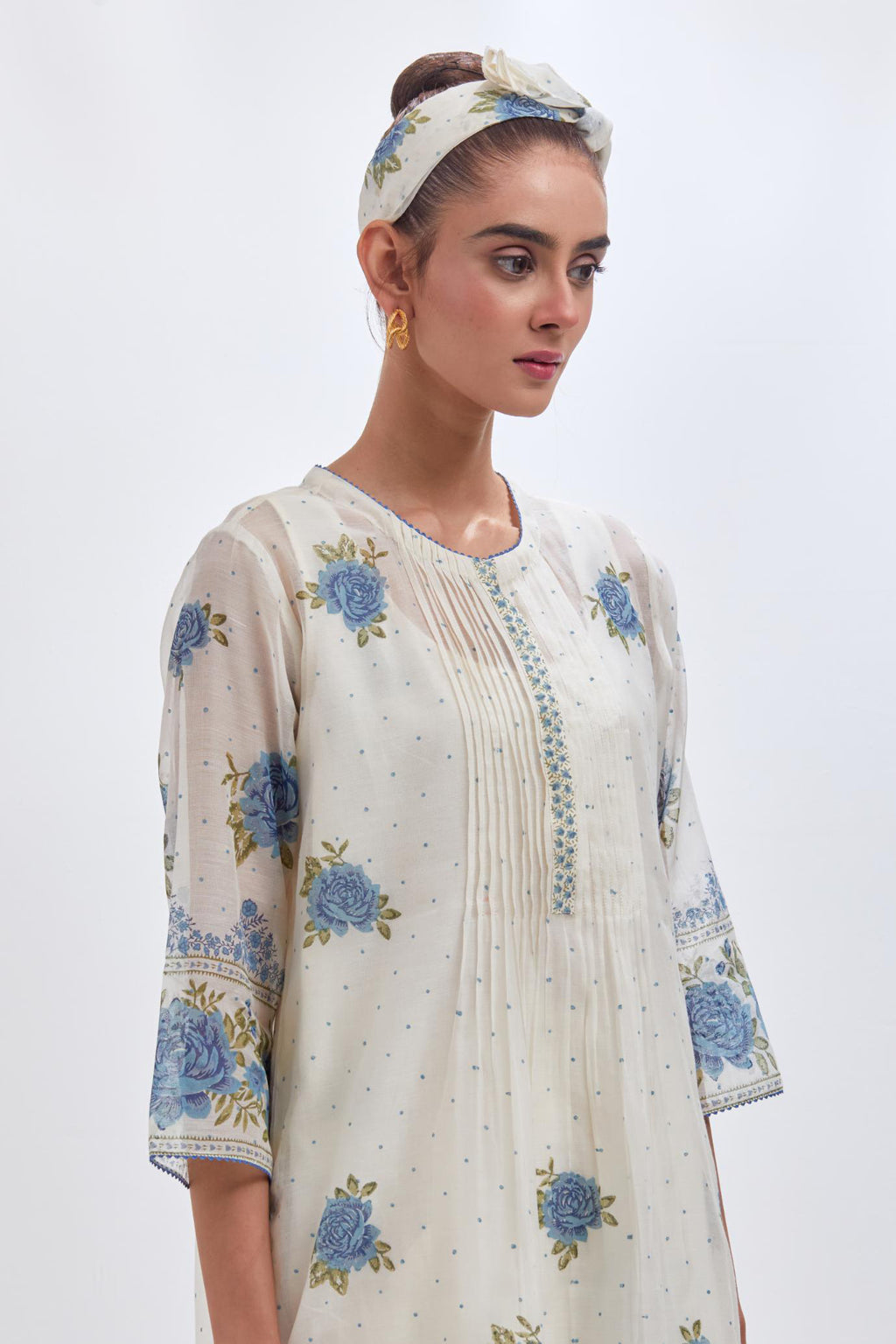 Off white cotton chanderi straight kurta set with all-over blue & green hand block print, highlighted with pin tucks at yoke.