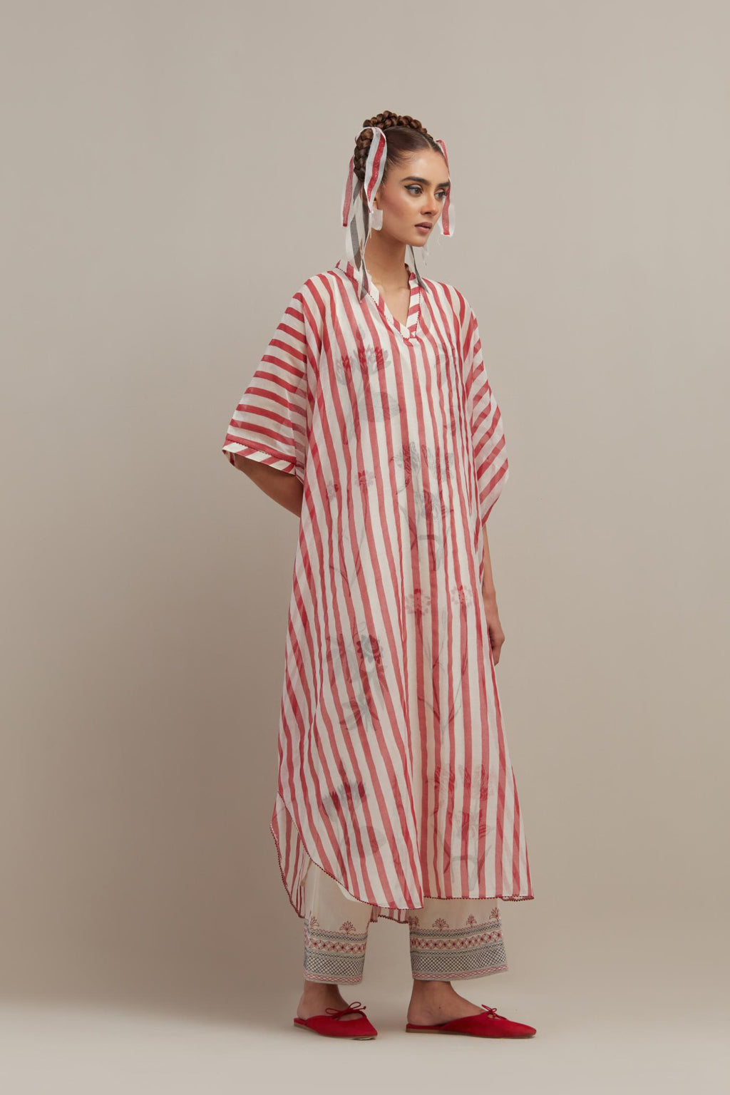 Red & off-white cotton chanderi hand block printed kaftan with round hem, paired with off white straight pants with quilted embroidery at bottom hem.