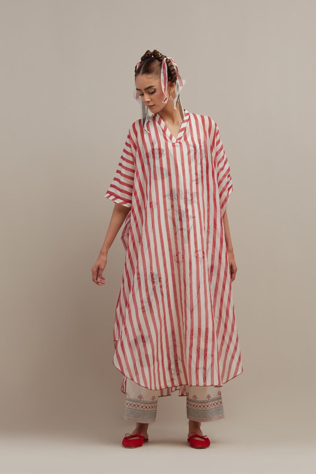 Red & off-white cotton chanderi hand block printed kaftan with round hem, paired with off white straight pants with quilted embroidery at bottom hem.