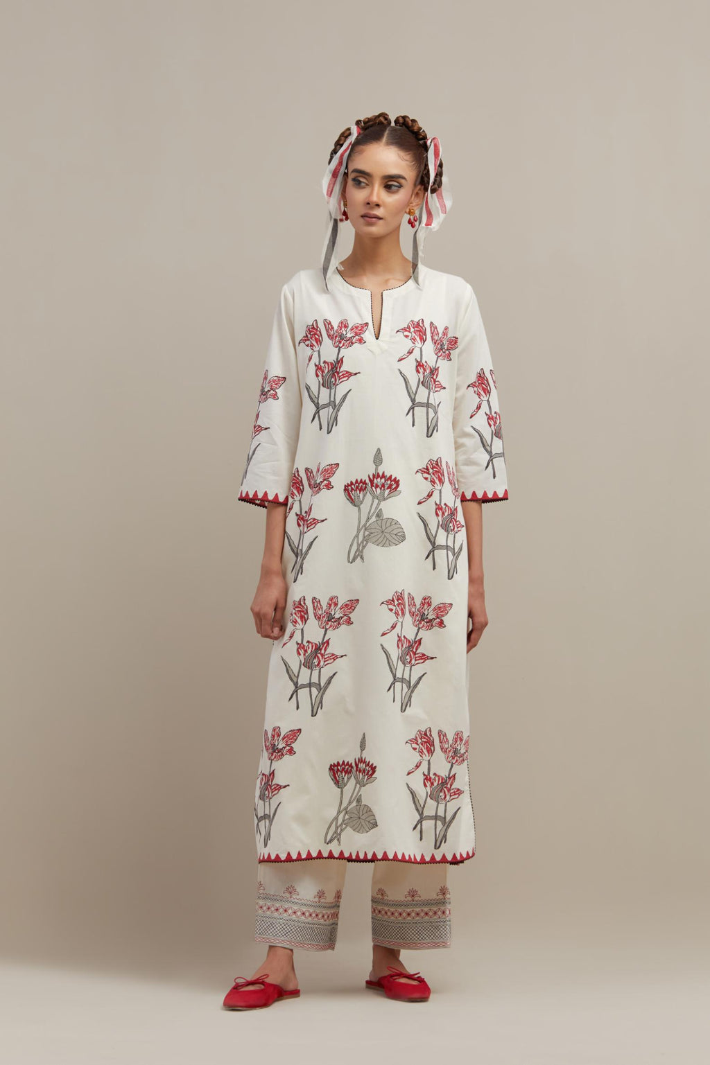 Off white cotton hand block printed kurta set with all-over red & black colored flower.