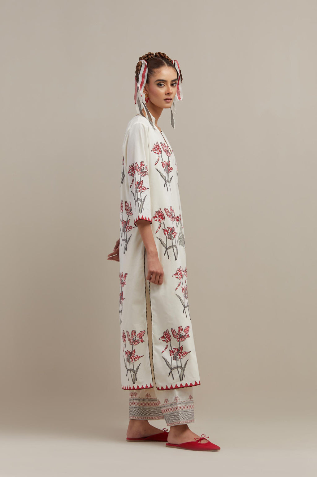 Off white cotton hand block printed kurta set with all-over red & black colored flower.