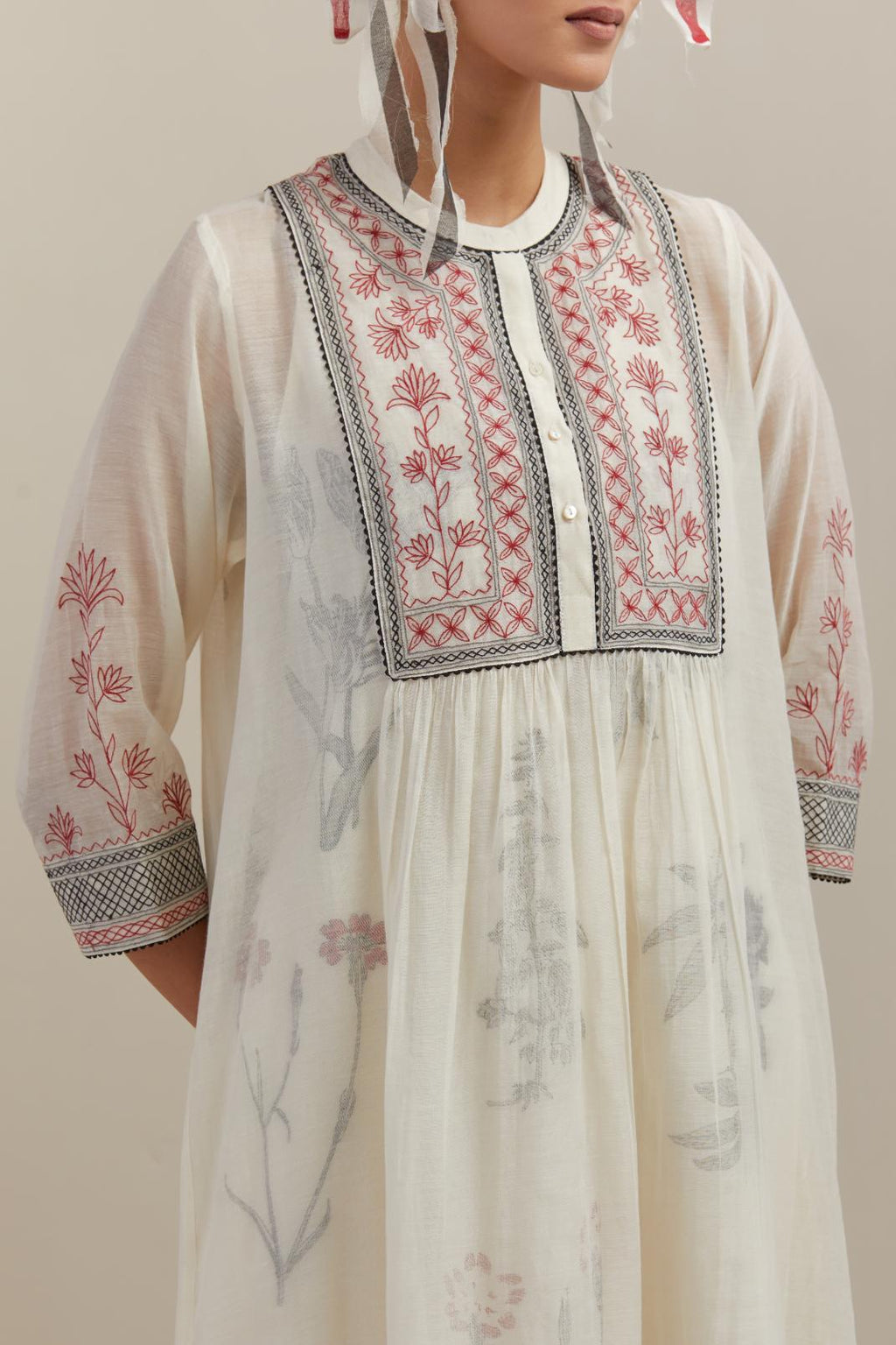 Off white cotton chanderi Kurta dress set with quilted embroidered yoke and hand block printed cotton slip inside.