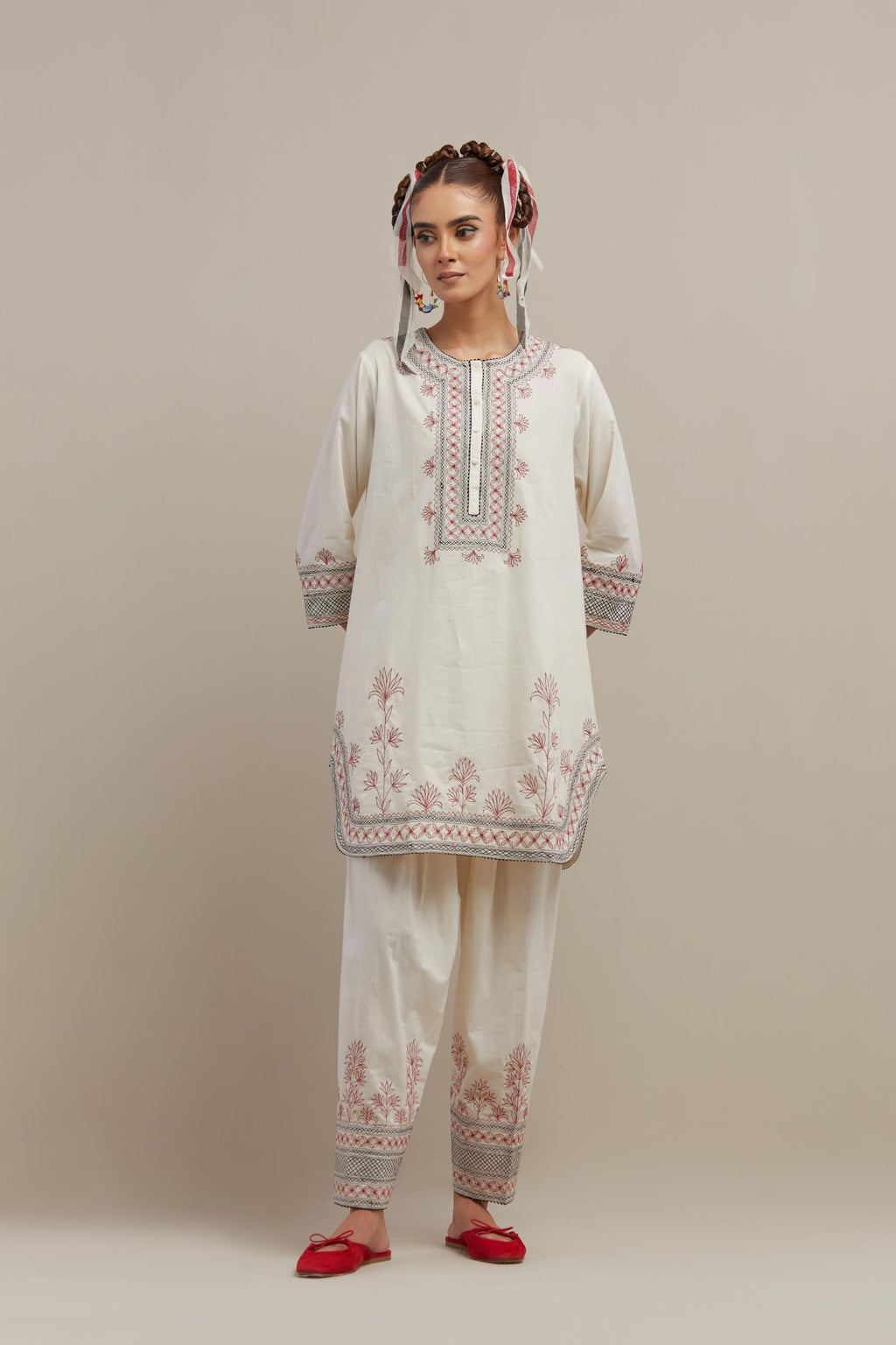 Off white cotton straight short kurta set with red & black embroidery at neck, hem and sleeves.