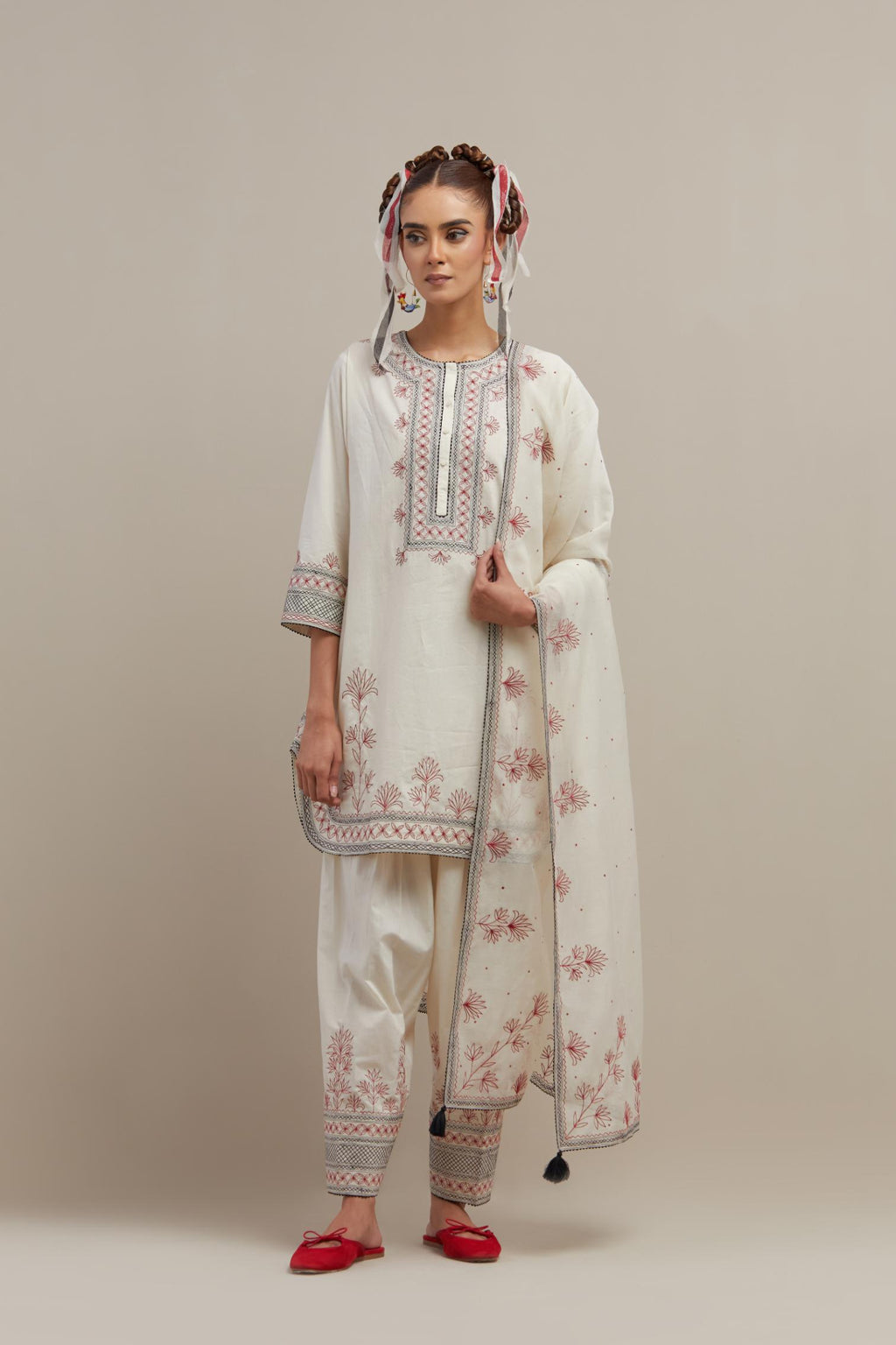 Off white cotton straight short kurta set with red & black embroidery at neck, hem and sleeves.