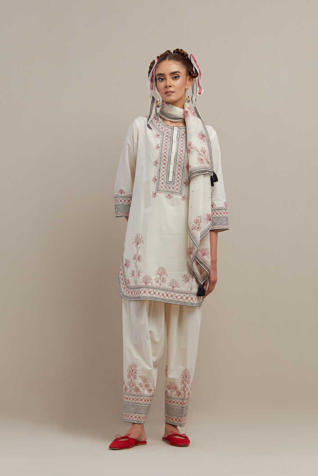 Off white cotton straight short kurta set with red & black embroidery at neck, hem and sleeves.