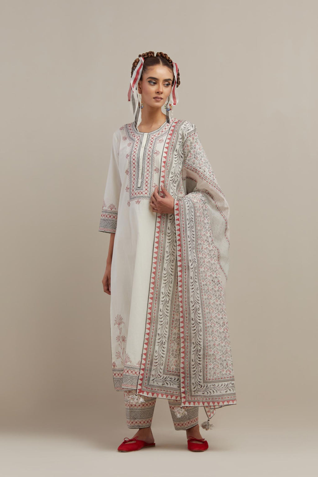 Off white cotton chanderi dupatta with all-over hand block print.