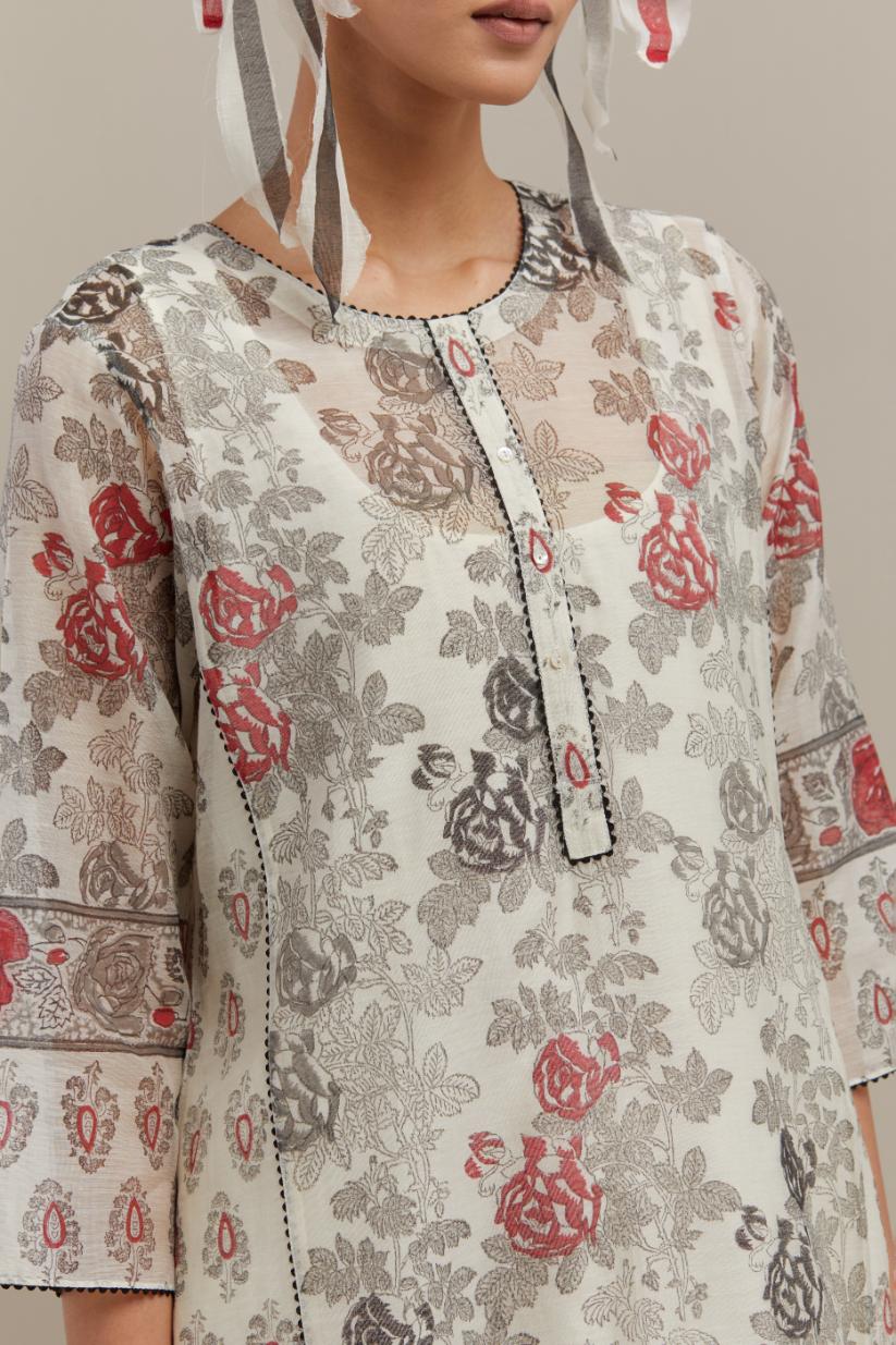 Off white cotton chanderi hand-block printed kurta set with side panels. highlighted with ricrac