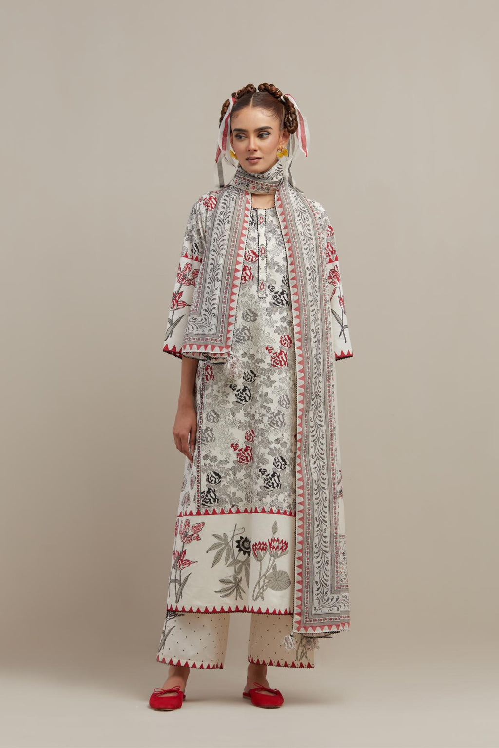 Off white cotton hand block printed straight kurta set with red & black colored flower and border detail at hem.