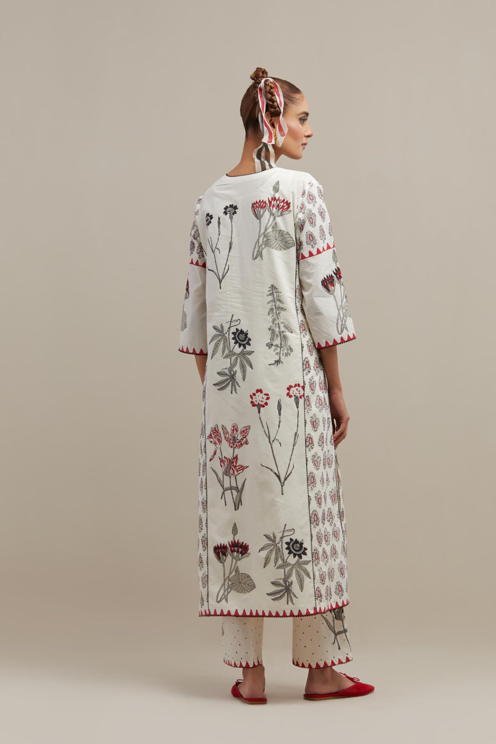 Off white cotton hand-block printed kurta set with side panels highlighted with ricrac.