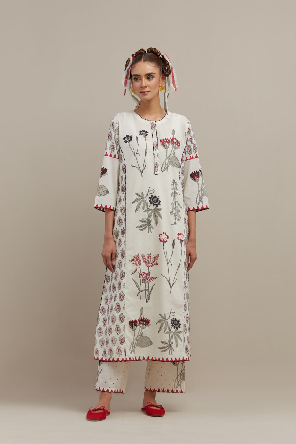 Off white cotton hand-block printed kurta set with side panels highlighted with ricrac.