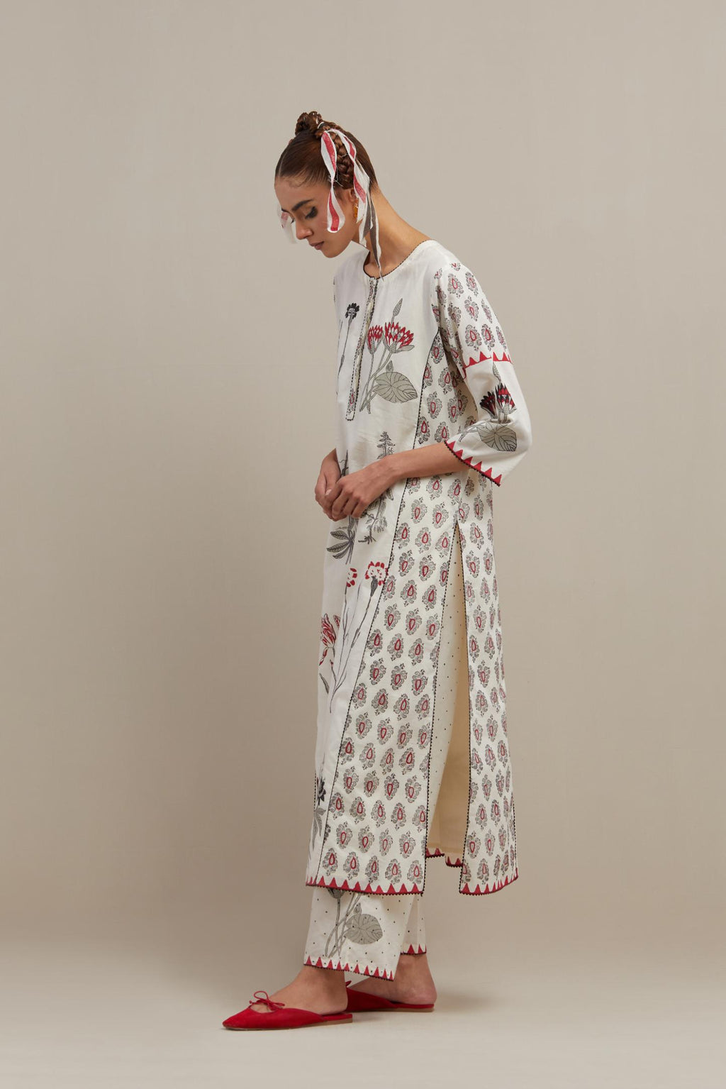 Off white cotton hand-block printed kurta set with side panels highlighted with ricrac.