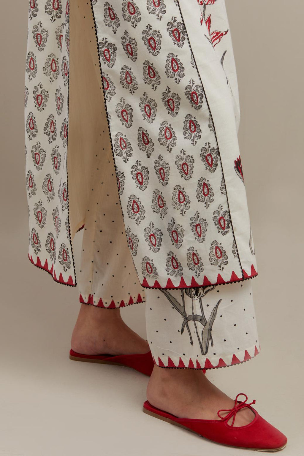 Off white cotton hand-block printed kurta set with side panels highlighted with ricrac.