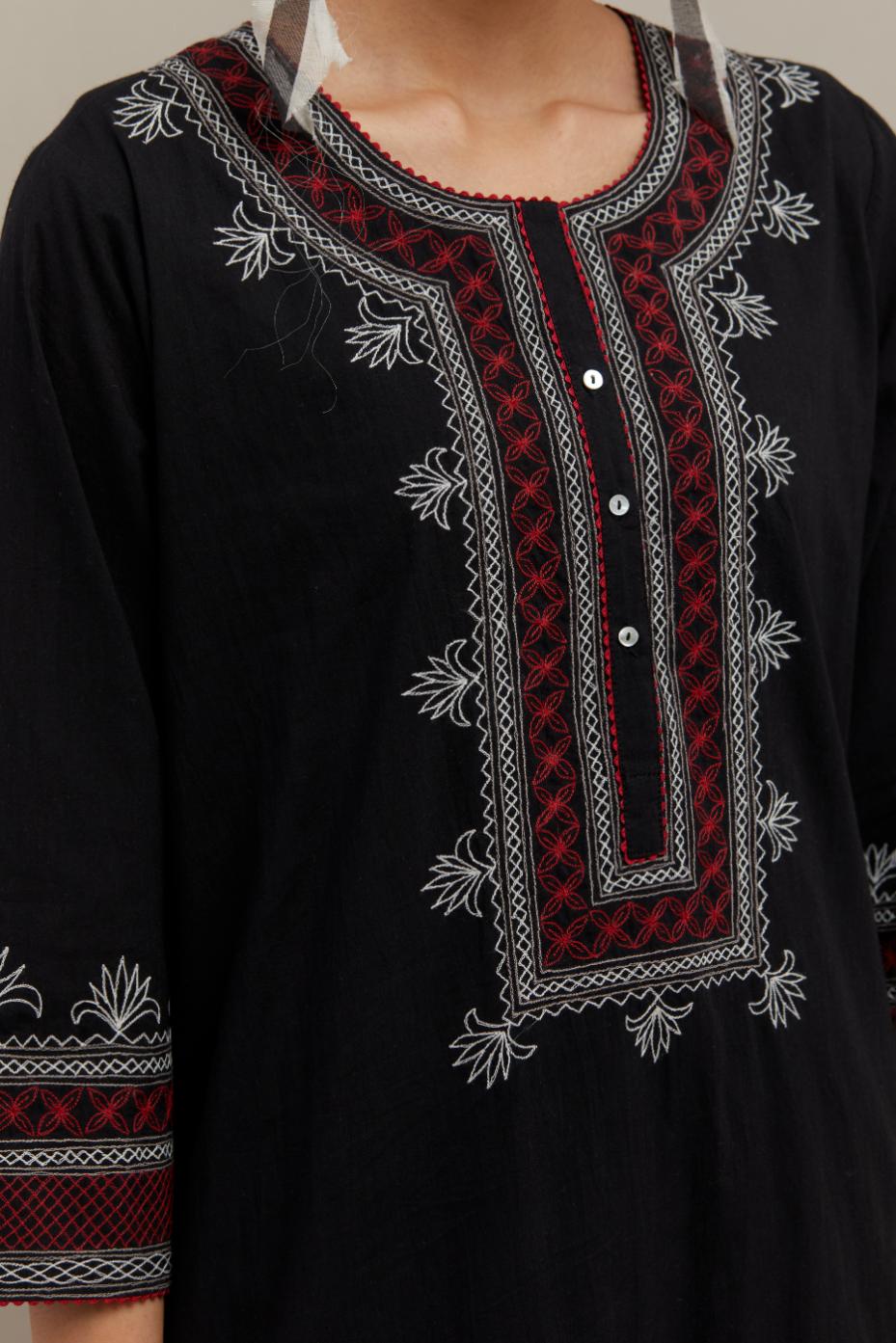 Black cotton straight kurta set with Red & off-white embroidery at neck, hem and sleeves.