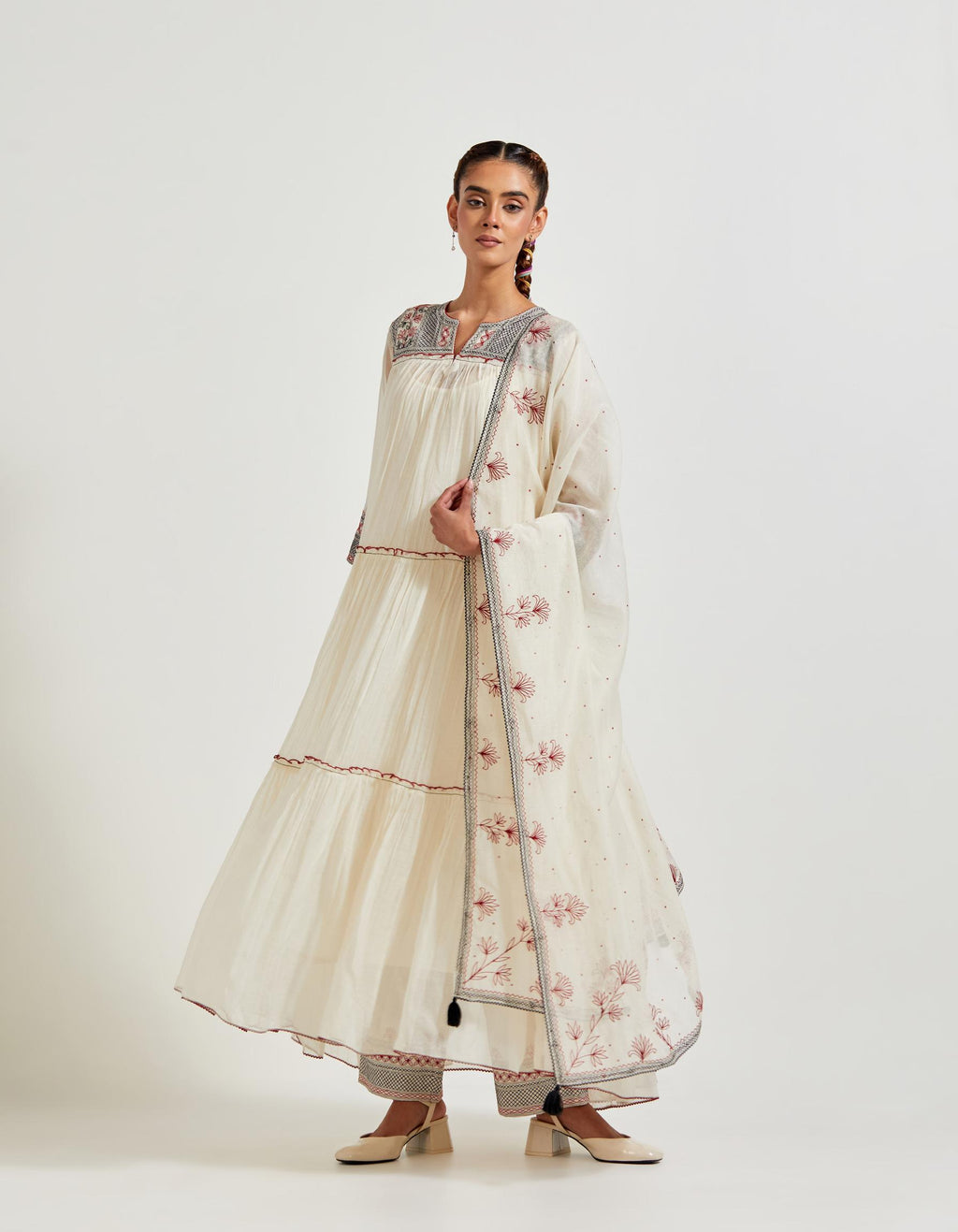 Off white three-tiered cotton chanderi kurta dress set with 3/4 sleeves, highlighted with quilted yoke in front and back.