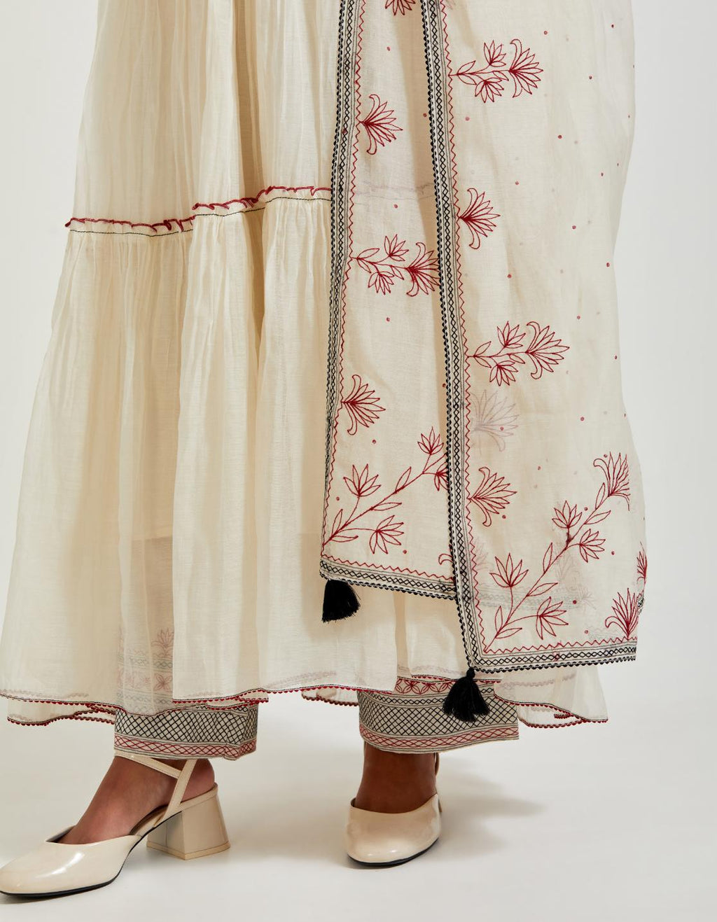 Off white three-tiered cotton chanderi kurta dress set with 3/4 sleeves, highlighted with quilted yoke in front and back.