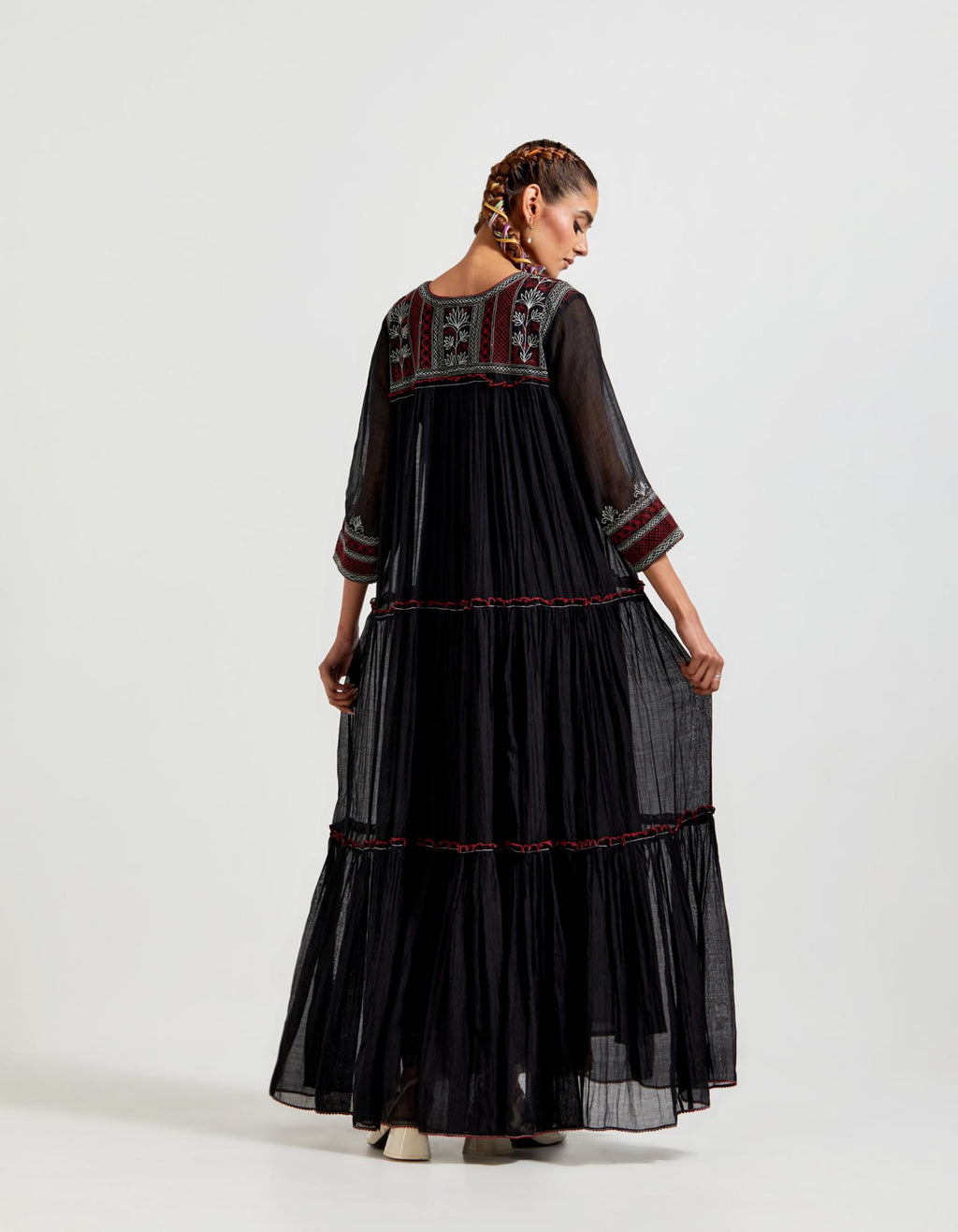 Black three-tiered cotton chanderi kurta dress set with 3/4 sleeves, highlighted with quilted yoke in front and back.