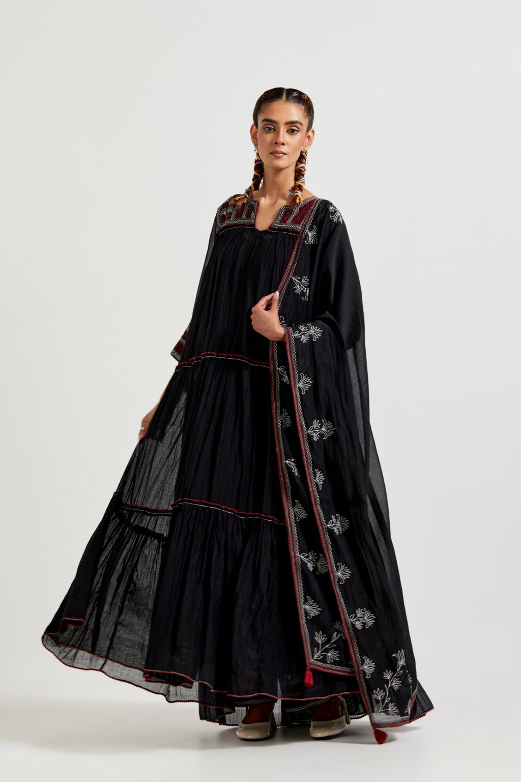 Black three-tiered cotton chanderi kurta dress set with 3/4 sleeves, highlighted with quilted yoke in front and back.