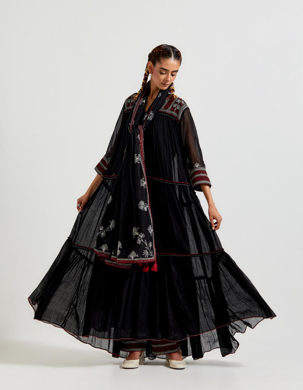 Black three-tiered cotton chanderi kurta dress set with 3/4 sleeves, highlighted with quilted yoke in front and back.