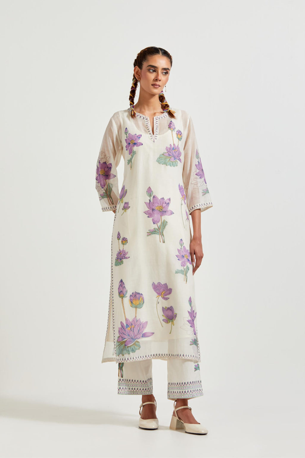 Off white cotton chanderi straight kurta set with all-over purple & green lotus flower hand block print.