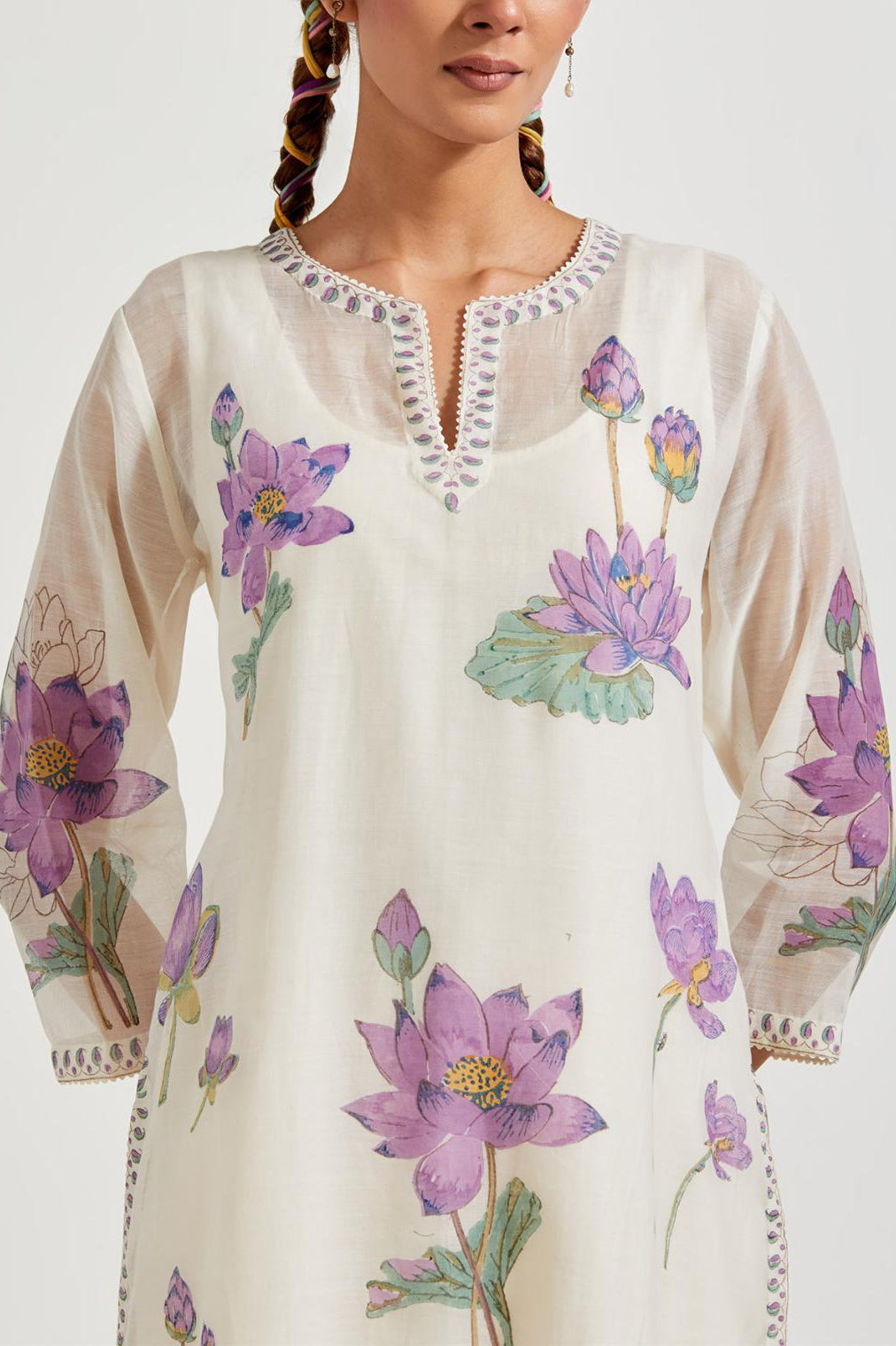 Off white cotton chanderi straight kurta set with all-over purple & green lotus flower hand block print.