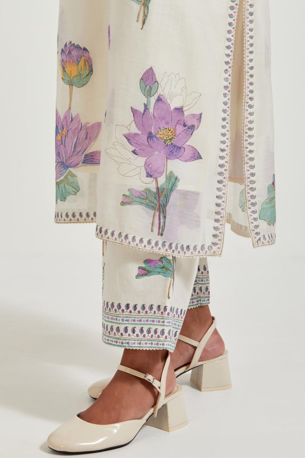 Off white cotton chanderi straight kurta set with all-over purple & green lotus flower hand block print.