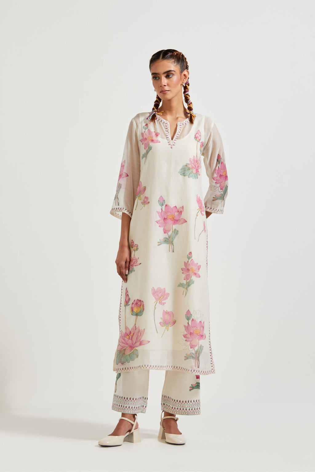 Off white cotton chanderi straight kurta set with all-over pink & green lotus flower hand block print.