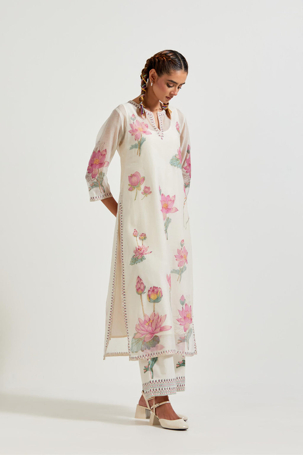 Off white cotton chanderi straight kurta set with all-over pink & green lotus flower hand block print.